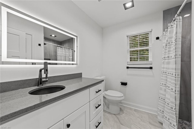 bathroom with toilet, vanity, and a shower with shower curtain