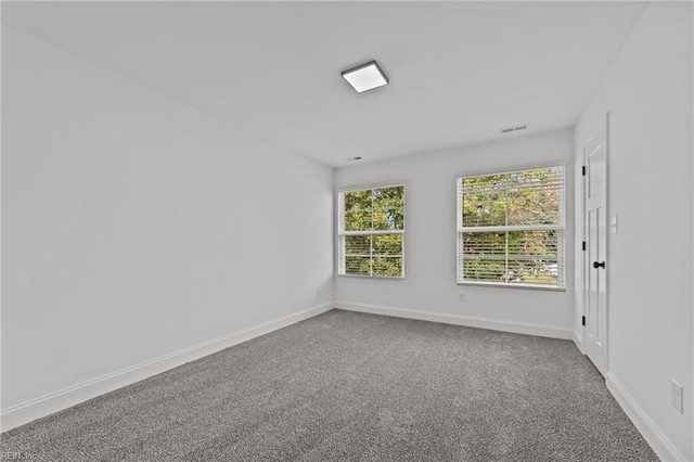 unfurnished room with carpet flooring