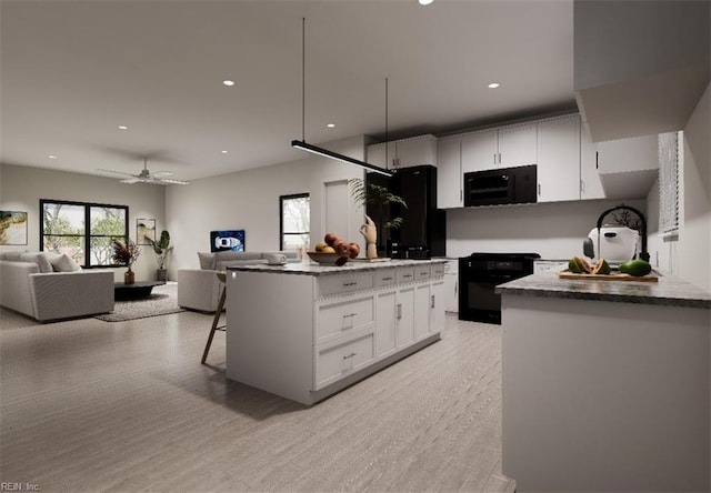 kitchen with light wood-type flooring, ceiling fan, black appliances, white cabinets, and a center island