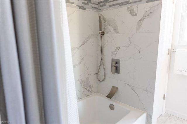 bathroom featuring tiled shower / bath combo