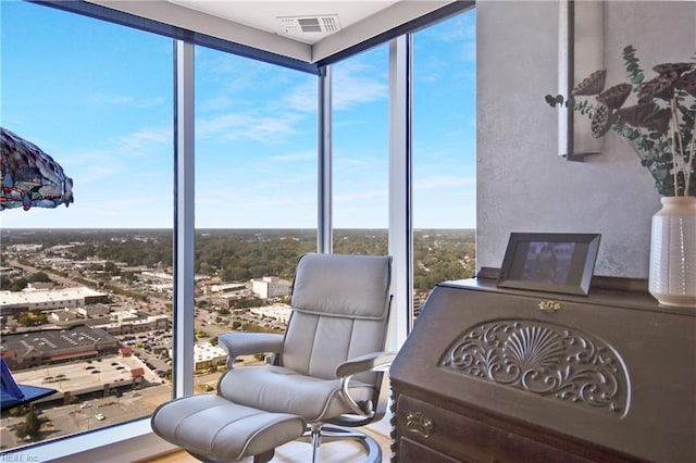 sitting room featuring a wall of windows