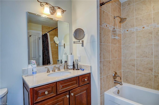 full bathroom with shower / tub combo with curtain, vanity, and toilet