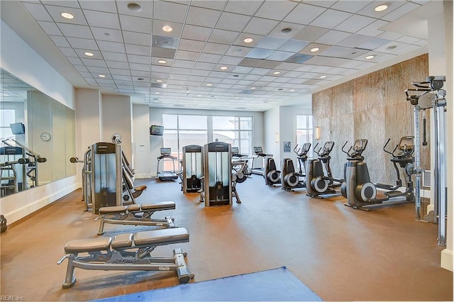 exercise room with recessed lighting and baseboards