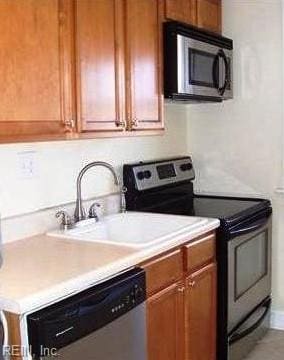 kitchen with appliances with stainless steel finishes and sink