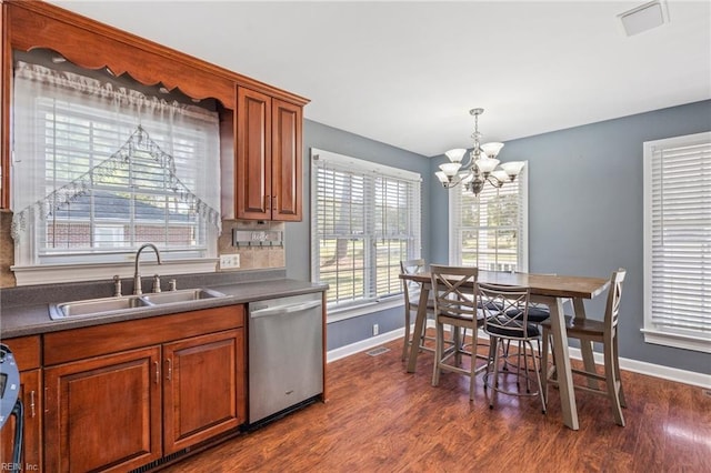 kitchen with dark wood-type flooring, sink, a chandelier, and dishwasher