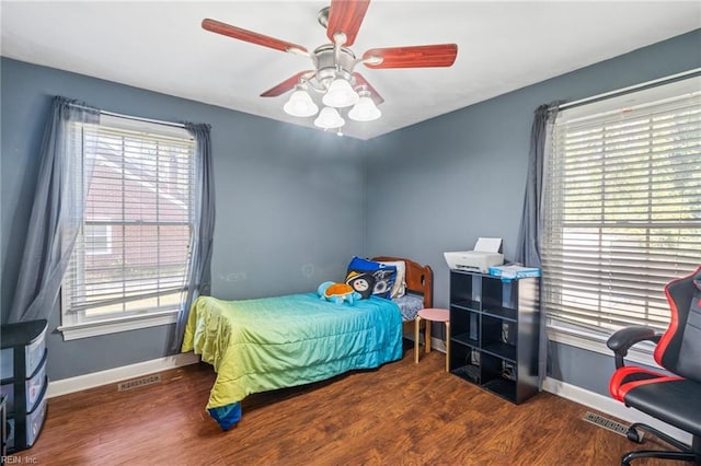 bedroom featuring dark hardwood / wood-style floors and ceiling fan