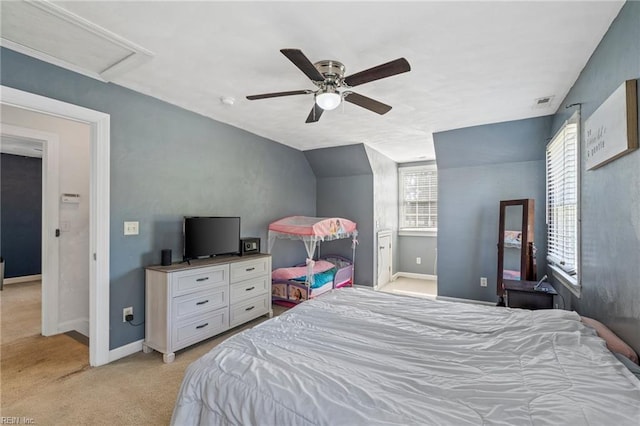 bedroom with lofted ceiling, light colored carpet, and ceiling fan