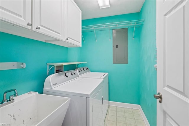 laundry area featuring electric panel, washer and dryer, sink, and cabinets