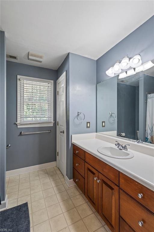 bathroom featuring tile patterned floors and vanity