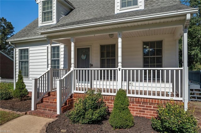 property entrance featuring a porch