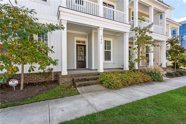 entrance to property with a balcony