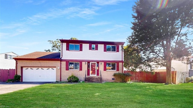 view of property featuring a garage and a front lawn