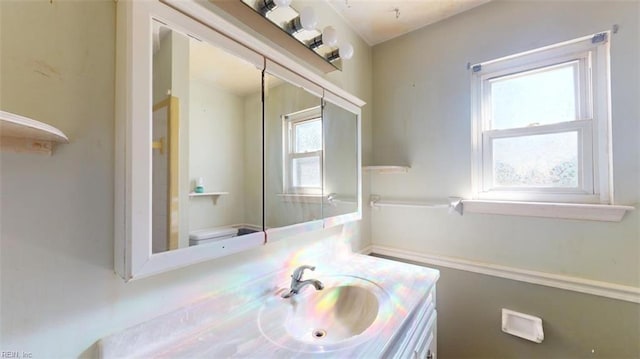 bathroom with vanity and toilet