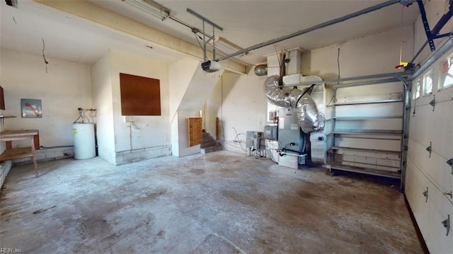 garage featuring a garage door opener, water heater, and heating unit