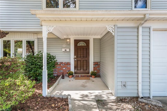 doorway to property featuring covered porch