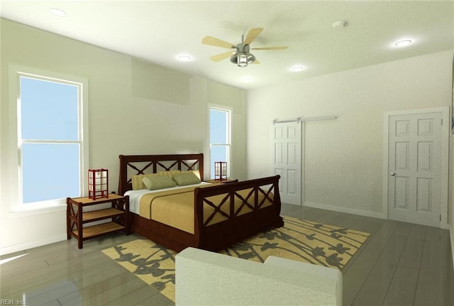 bedroom with multiple windows, hardwood / wood-style flooring, and ceiling fan