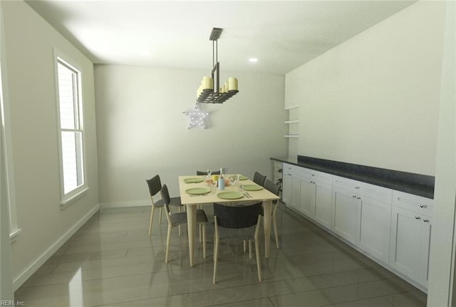 tiled dining area featuring a chandelier and plenty of natural light