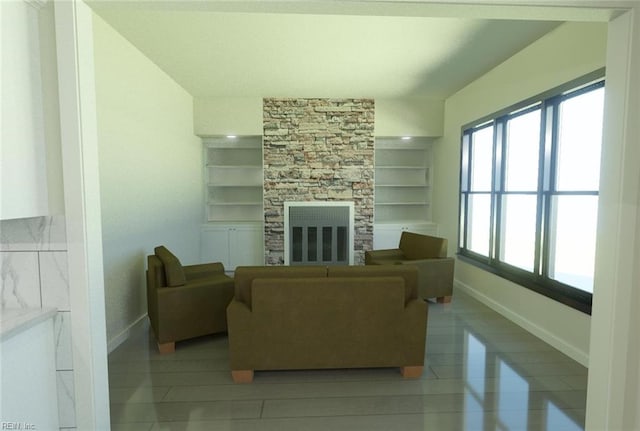 living room with a stone fireplace, built in features, and light tile patterned floors