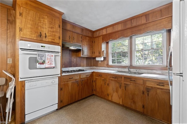 kitchen with sink and white appliances