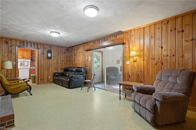 living room with wood walls