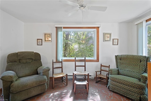 sitting room with ceiling fan and a healthy amount of sunlight