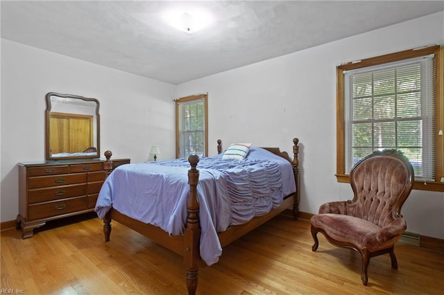 bedroom with light wood-type flooring