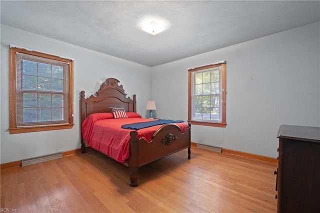 bedroom with light hardwood / wood-style floors