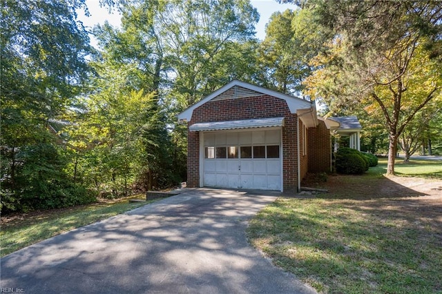 garage featuring a yard