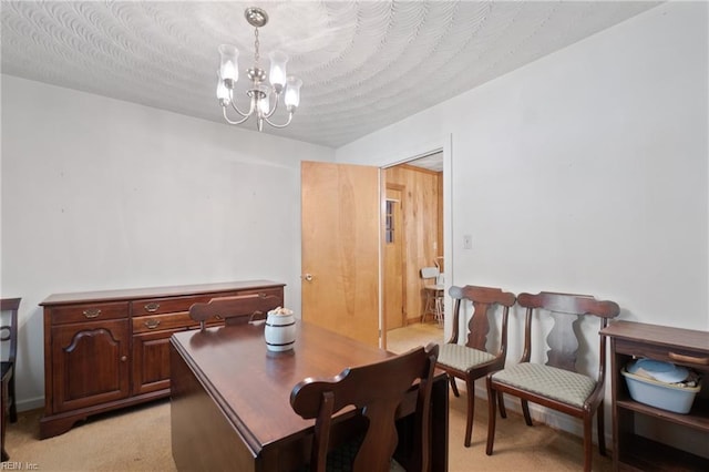 carpeted dining space featuring a textured ceiling and a chandelier