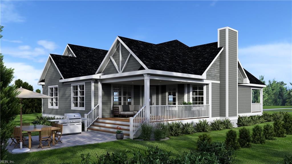 view of front of home with a patio area, a porch, and a front lawn