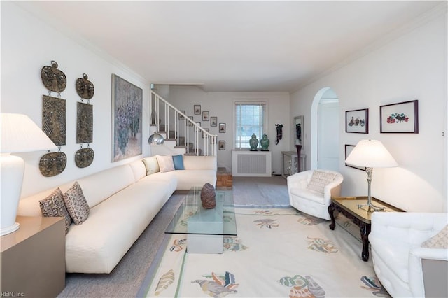 living room featuring ornamental molding and radiator heating unit