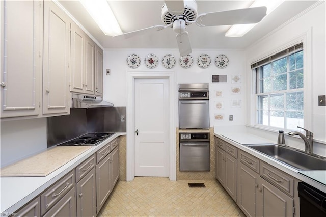 kitchen with ceiling fan, stainless steel gas stovetop, ornamental molding, dishwasher, and sink