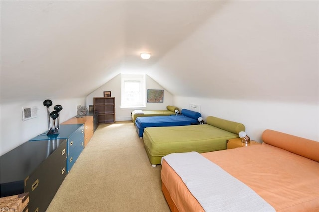 bedroom featuring lofted ceiling and carpet floors