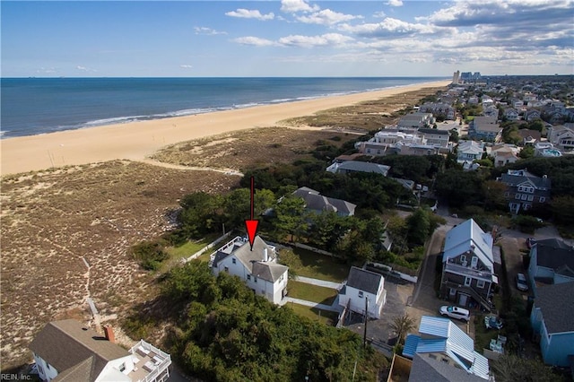 aerial view featuring a water view and a beach view