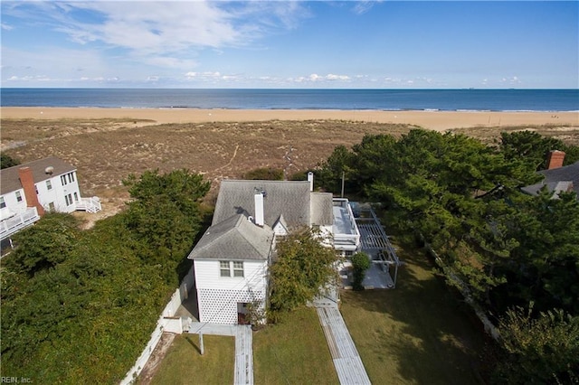 aerial view with a water view and a beach view