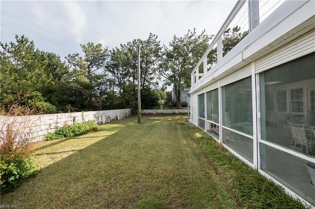 view of yard featuring a sunroom