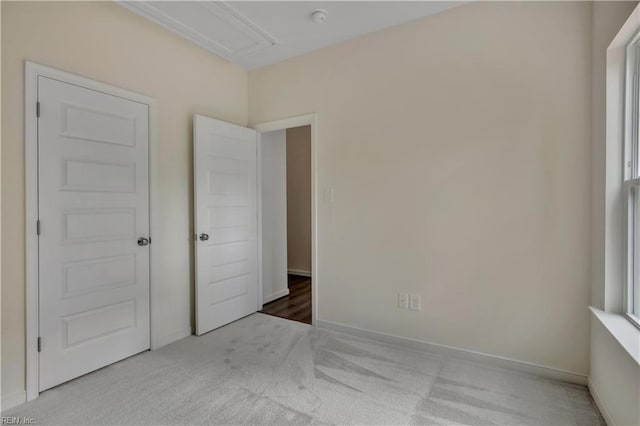 unfurnished bedroom featuring baseboards and carpet floors