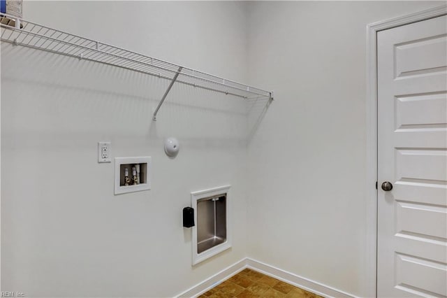 laundry room featuring baseboards, washer hookup, laundry area, hookup for a gas dryer, and hookup for an electric dryer