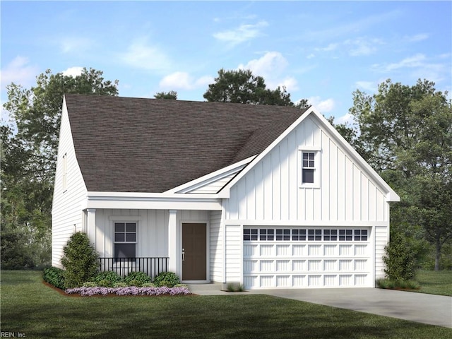 view of front of home featuring board and batten siding, a shingled roof, a front lawn, and concrete driveway