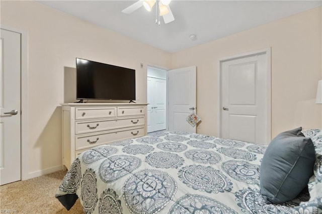 bedroom featuring ceiling fan and light colored carpet