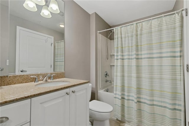 full bathroom featuring shower / bath combo, vanity, and toilet