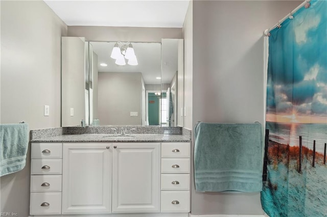 bathroom featuring vanity and an inviting chandelier