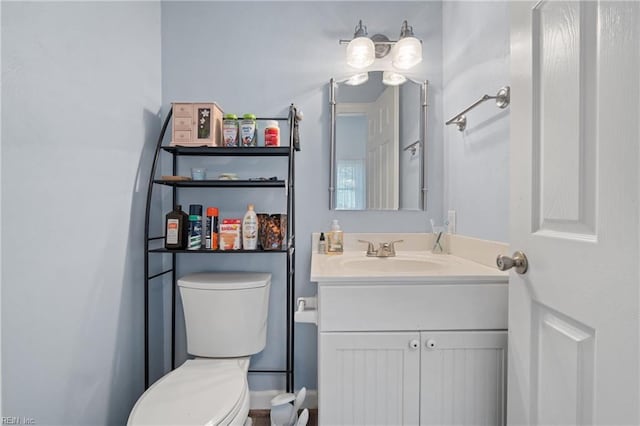 bathroom with vanity and toilet