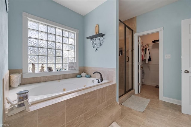 bathroom with tile patterned floors and plus walk in shower