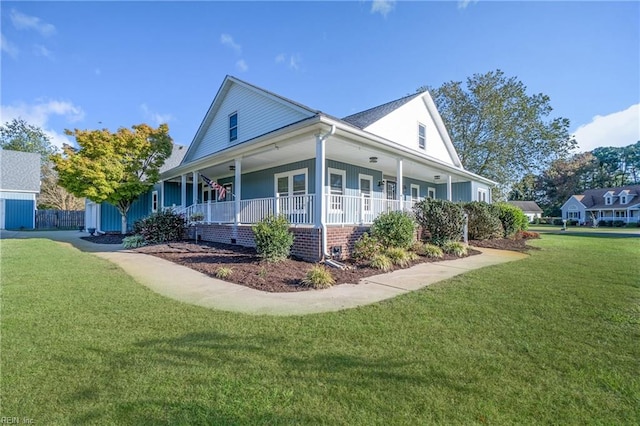 view of property exterior with a yard, covered porch, and central AC