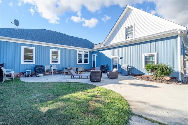 back of house featuring a yard and a patio area