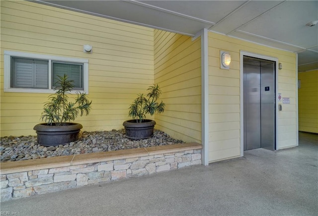 doorway to property featuring elevator