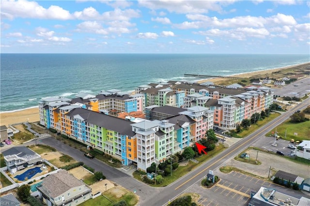 bird's eye view with a water view and a view of the beach