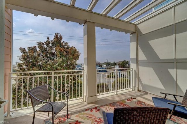 balcony featuring a pergola