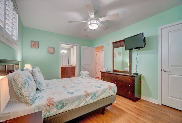 bedroom featuring connected bathroom, light hardwood / wood-style flooring, and ceiling fan